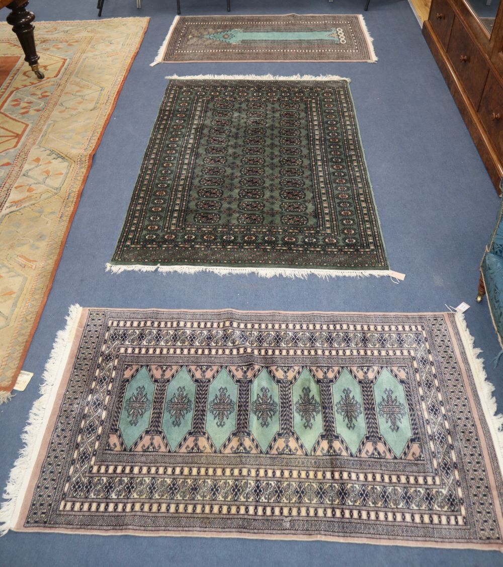 A Pakistan Bokhara prayer rug and two other rugs, largest 190 x 127cm
